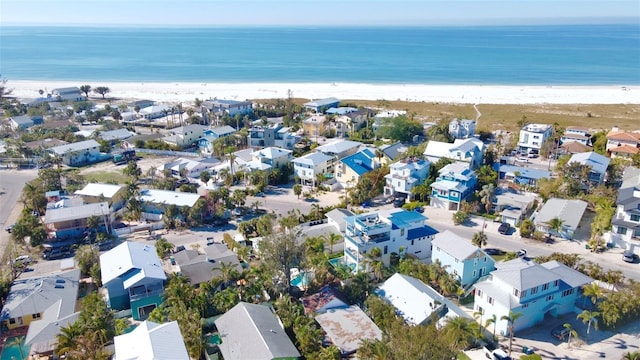 bird's eye view with a water view and a view of the beach