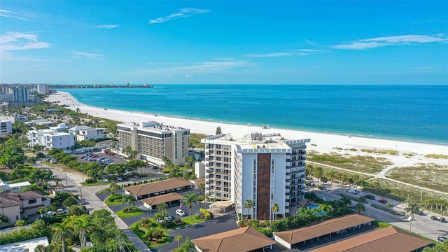 drone / aerial view featuring a view of the beach and a water view