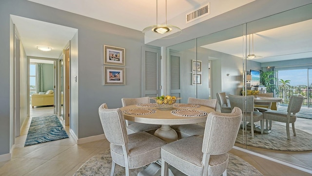 dining space with light tile patterned floors