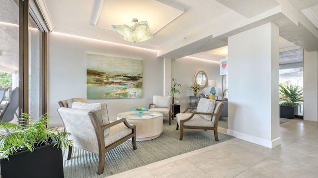 sitting room featuring a wealth of natural light and light tile patterned floors