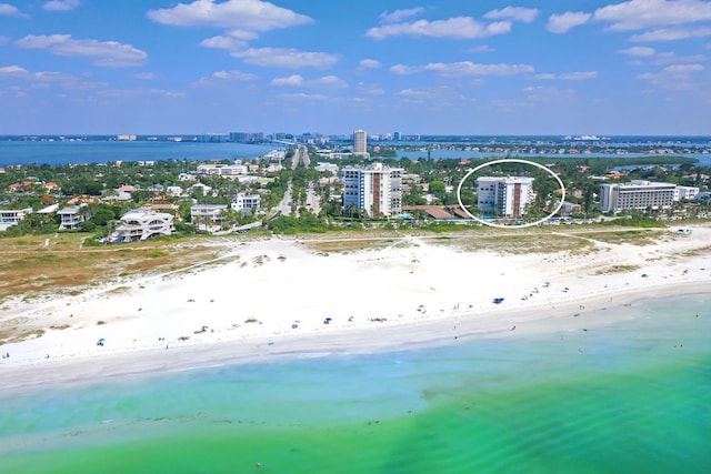 aerial view featuring a water view and a beach view