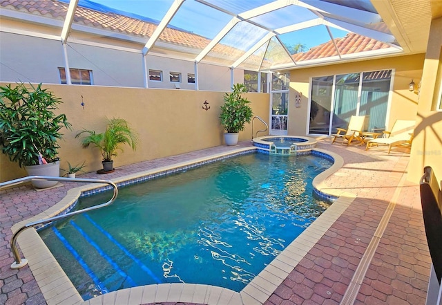 view of swimming pool featuring a patio area, an in ground hot tub, and glass enclosure