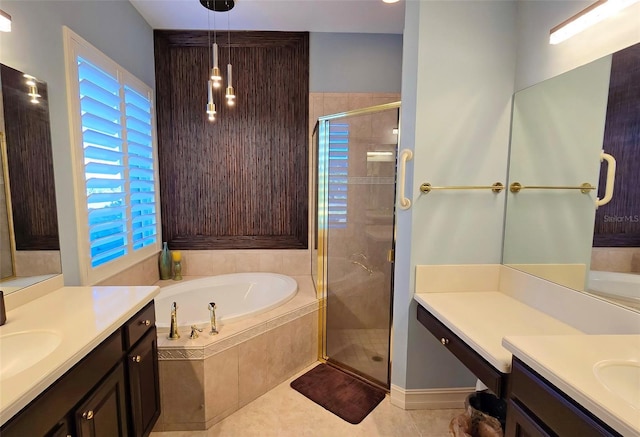 bathroom with tile patterned flooring, vanity, and independent shower and bath