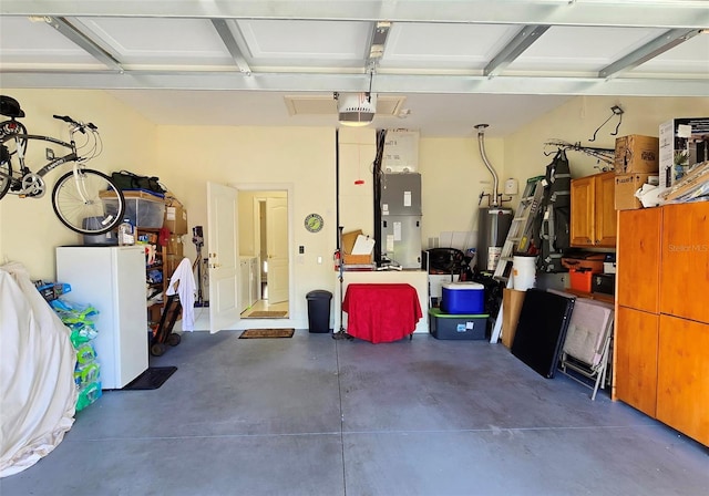 garage with a garage door opener and water heater