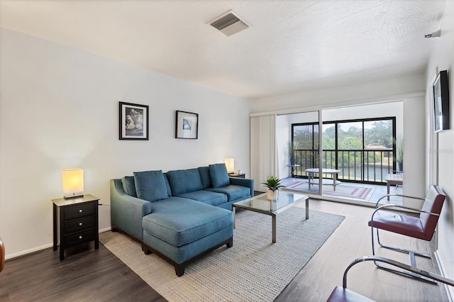 2124 N Tamiami Trl Unit 103, Sarasota, FL 34234 - living area with wood finished floors and baseboards