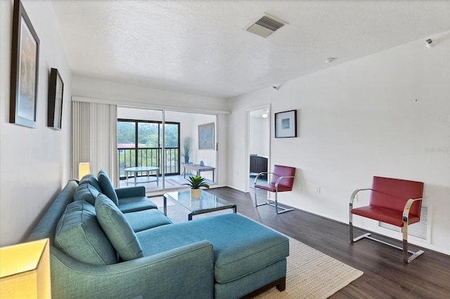 2124 N Tamiami Trl Unit 103, Sarasota, FL 34234 - living area with dark wood finished floors and baseboards