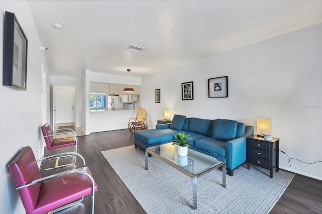 2124 N Tamiami Trl Unit 103, Sarasota, FL 34234 - living area with wood finished floors