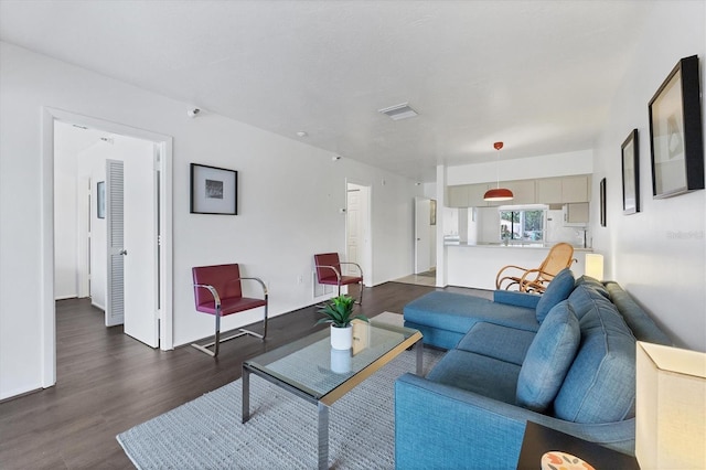 2124 N Tamiami Trl Unit 103, Sarasota, FL 34234 - living room with dark wood finished floors
