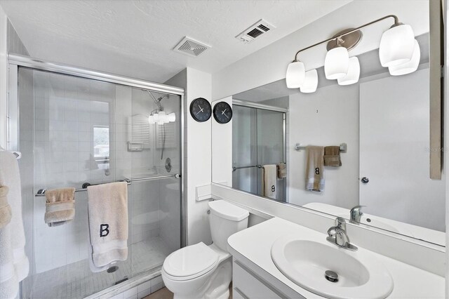 2124 N Tamiami Trl Unit 103, Sarasota, FL 34234 - full bath with toilet, a stall shower, and vanity