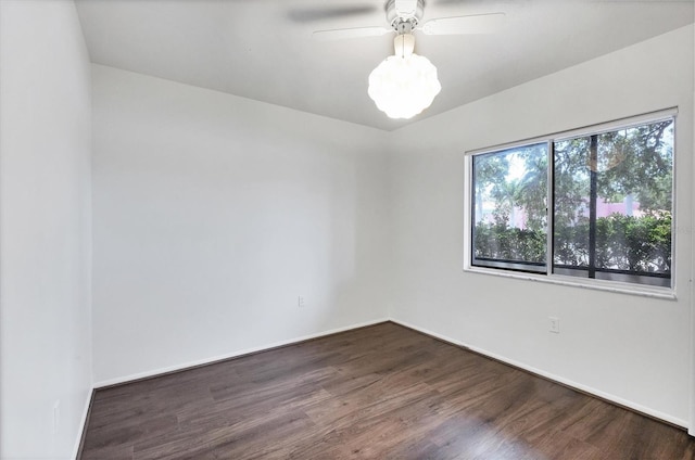 2124 N Tamiami Trl Unit 103, Sarasota, FL 34234 - spare room with dark wood-type flooring, baseboards, and a ceiling fan