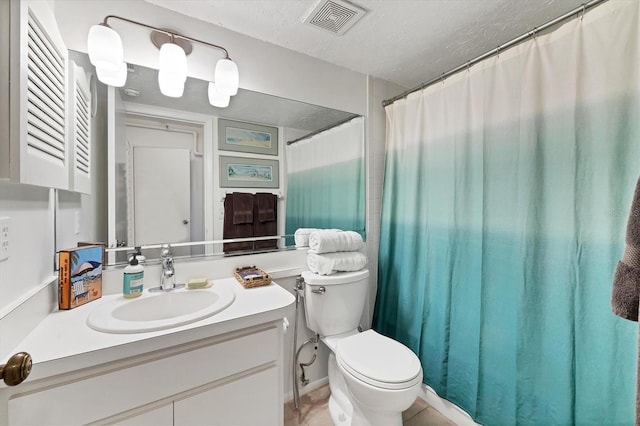 2124 N Tamiami Trl Unit 103, Sarasota, FL 34234 - bathroom with toilet, vanity, a shower with curtain, and a textured ceiling