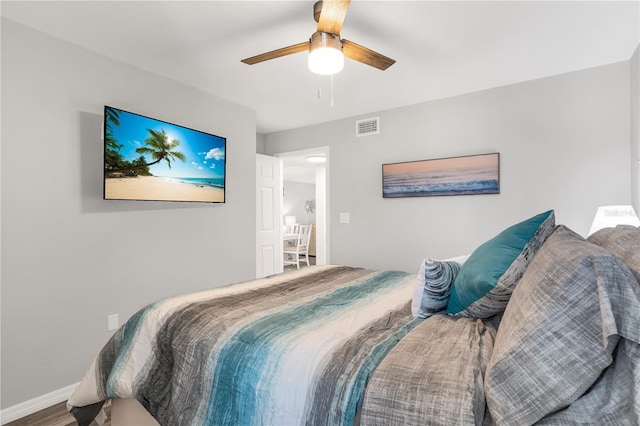 bedroom featuring ceiling fan and wood-type flooring