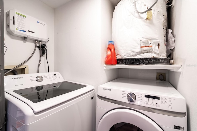 laundry area featuring separate washer and dryer and water heater