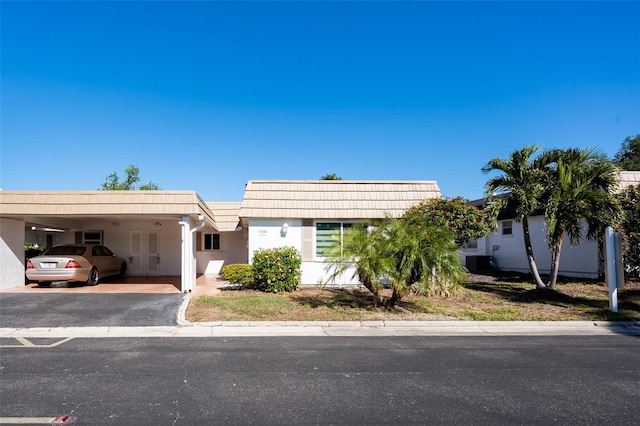 view of front of home with a carport