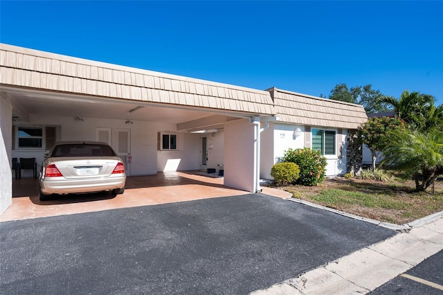 view of front of home with a carport