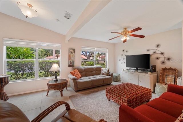 living room featuring ceiling fan, light tile patterned floors, radiator heating unit, and vaulted ceiling