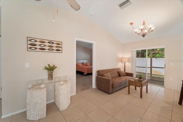 tiled living room with a chandelier and vaulted ceiling