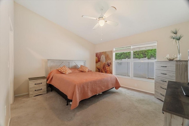 carpeted bedroom featuring ceiling fan and lofted ceiling