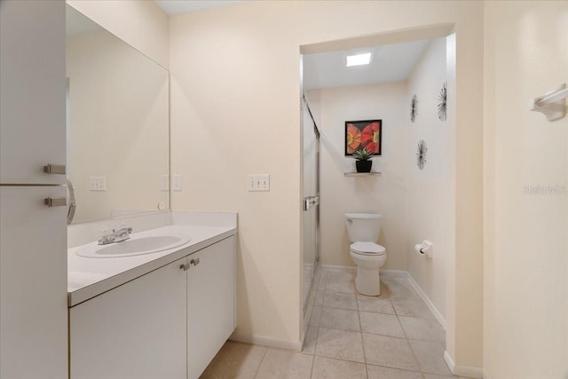 bathroom with walk in shower, tile patterned flooring, vanity, and toilet