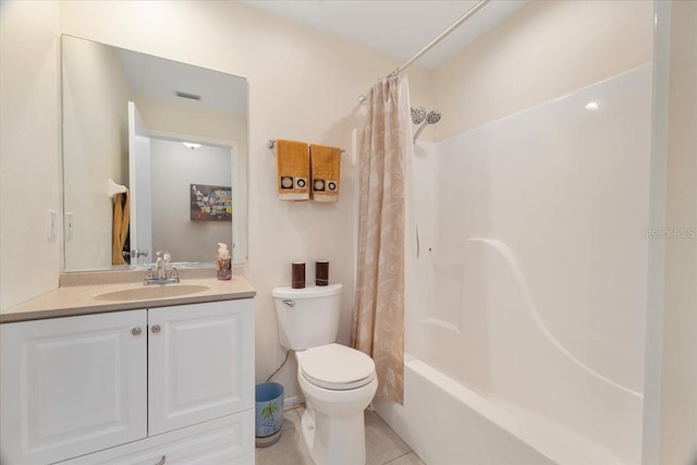 full bathroom featuring tile patterned floors, shower / bath combo with shower curtain, vanity, and toilet