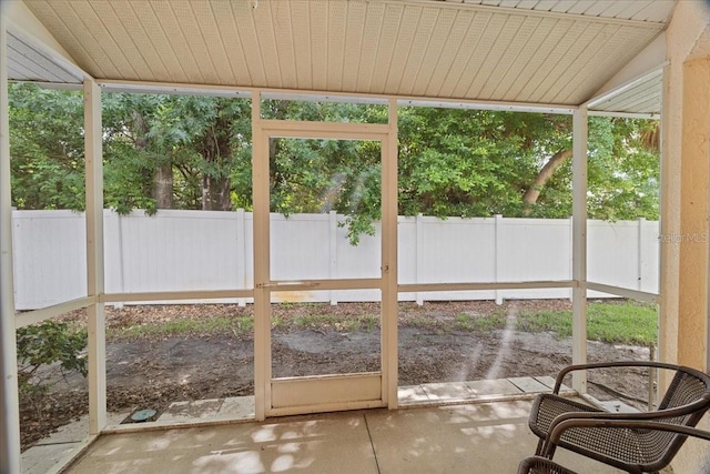 unfurnished sunroom with vaulted ceiling