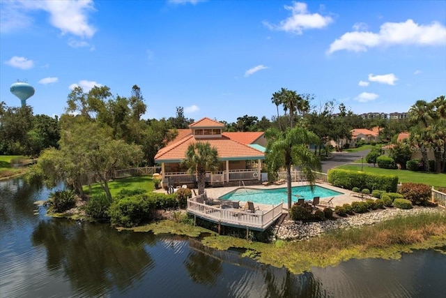 view of pool featuring a water view