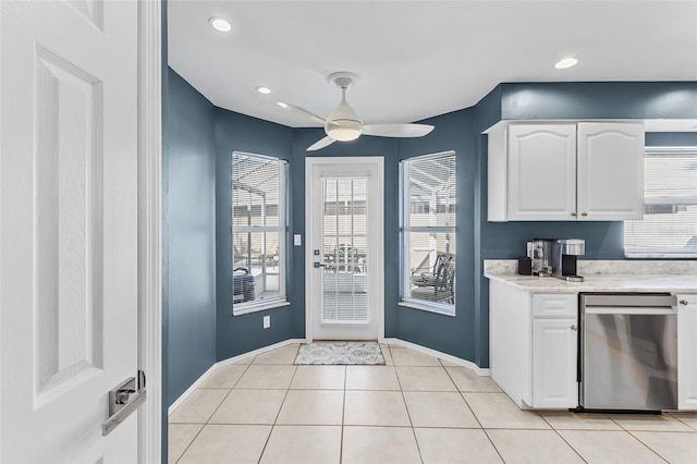 kitchen with dishwasher, white cabinetry, ceiling fan, and a healthy amount of sunlight