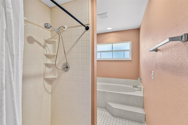 bathroom with tile patterned floors and walk in shower