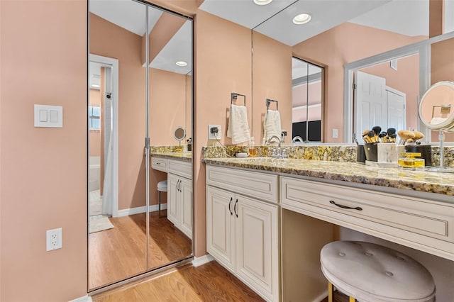 bathroom featuring hardwood / wood-style floors and vanity