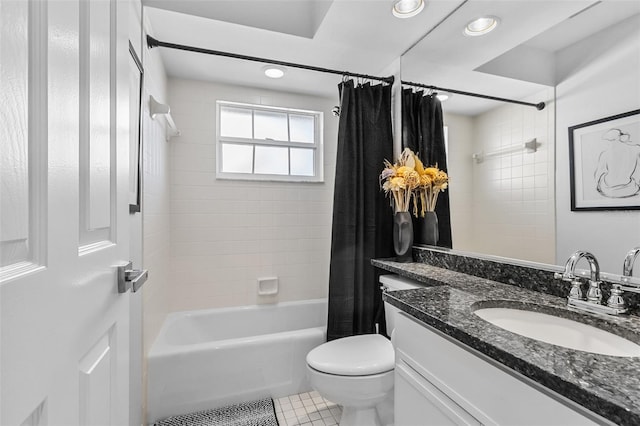 full bathroom featuring tile patterned floors, vanity, shower / bath combination with curtain, and toilet