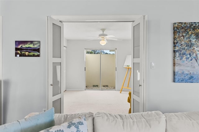 living room featuring ceiling fan and carpet floors