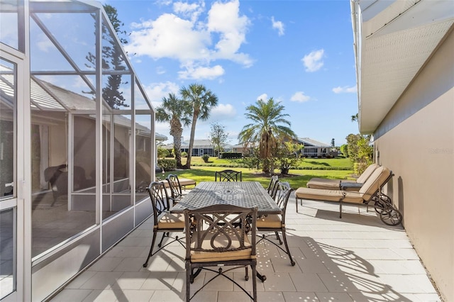 view of patio / terrace with a lanai