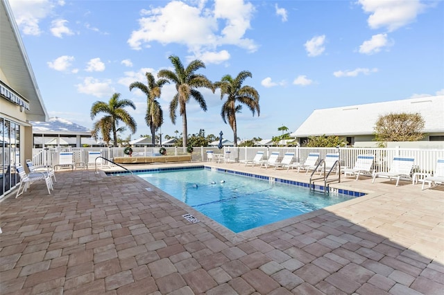 view of pool featuring a patio