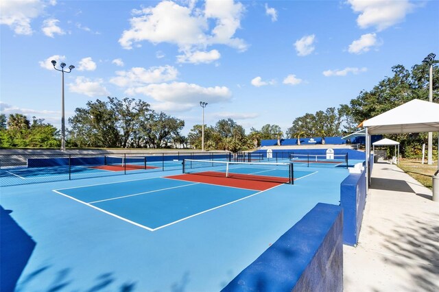 view of sport court with basketball hoop