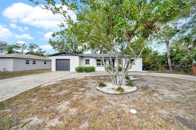 ranch-style home with a garage