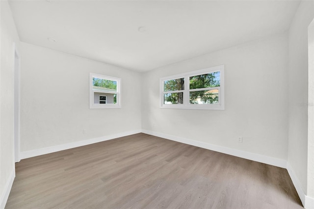 unfurnished room with light hardwood / wood-style floors