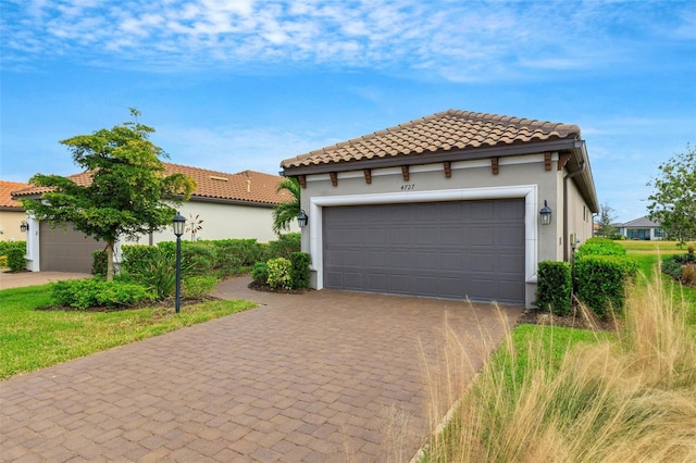 mediterranean / spanish-style home featuring a garage