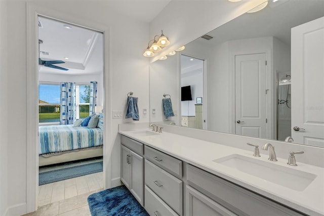 bathroom featuring tile patterned floors, ceiling fan, and vanity