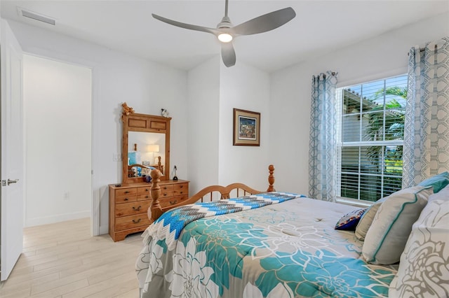 bedroom with ceiling fan and light wood-type flooring