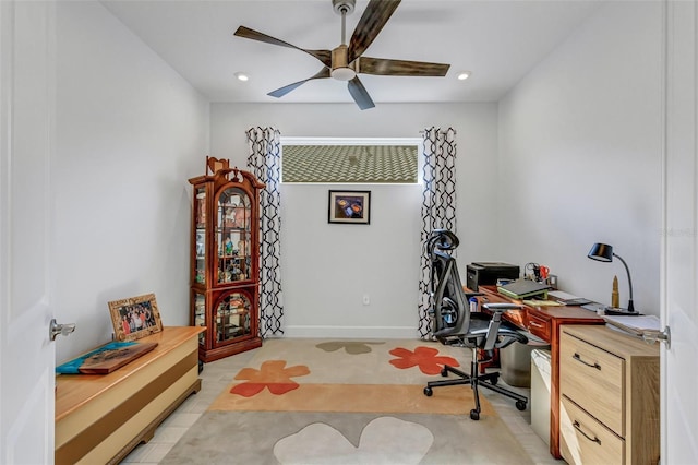 tiled home office featuring ceiling fan