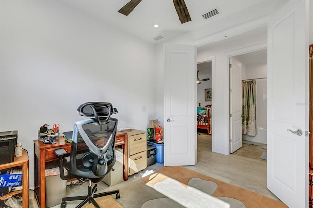 office space featuring light wood-type flooring and ceiling fan