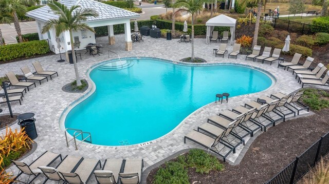 view of swimming pool featuring a gazebo and a patio