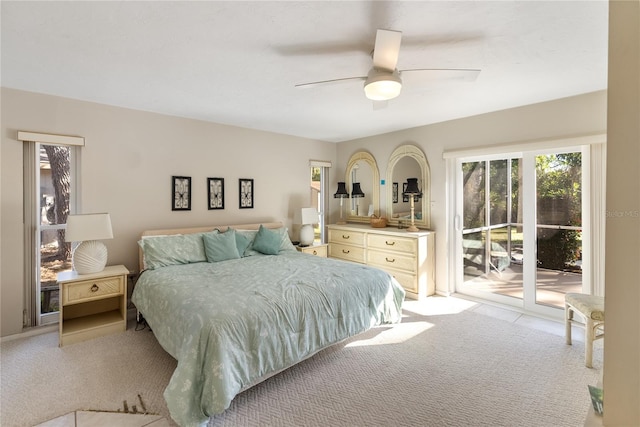 carpeted bedroom featuring access to outside and ceiling fan