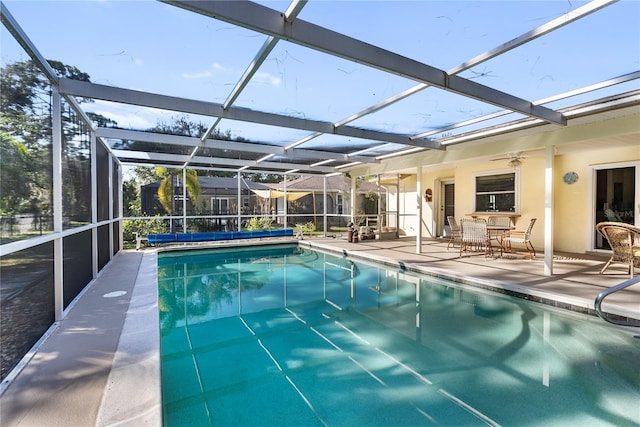 view of pool featuring ceiling fan, a lanai, and a patio