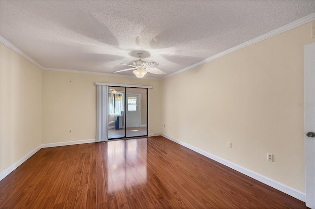 empty room featuring hardwood / wood-style floors, ceiling fan, ornamental molding, and a textured ceiling