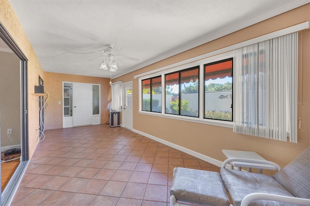 interior space with plenty of natural light, ceiling fan, and light tile patterned floors