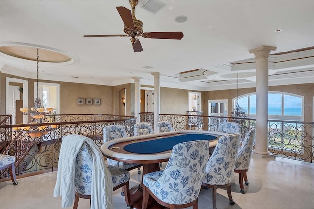 dining space with ceiling fan with notable chandelier, a water view, crown molding, and coffered ceiling