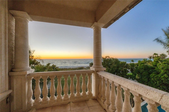 balcony at dusk with a water view