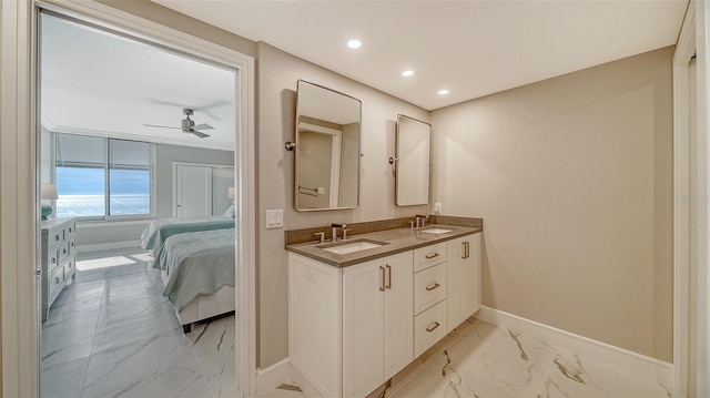 bathroom with ceiling fan and vanity