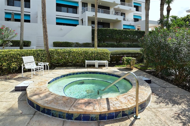 view of pool with a community hot tub